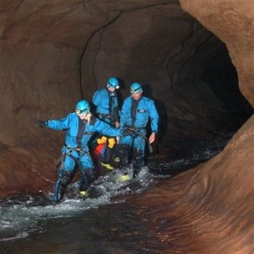 caving three people caving three people
